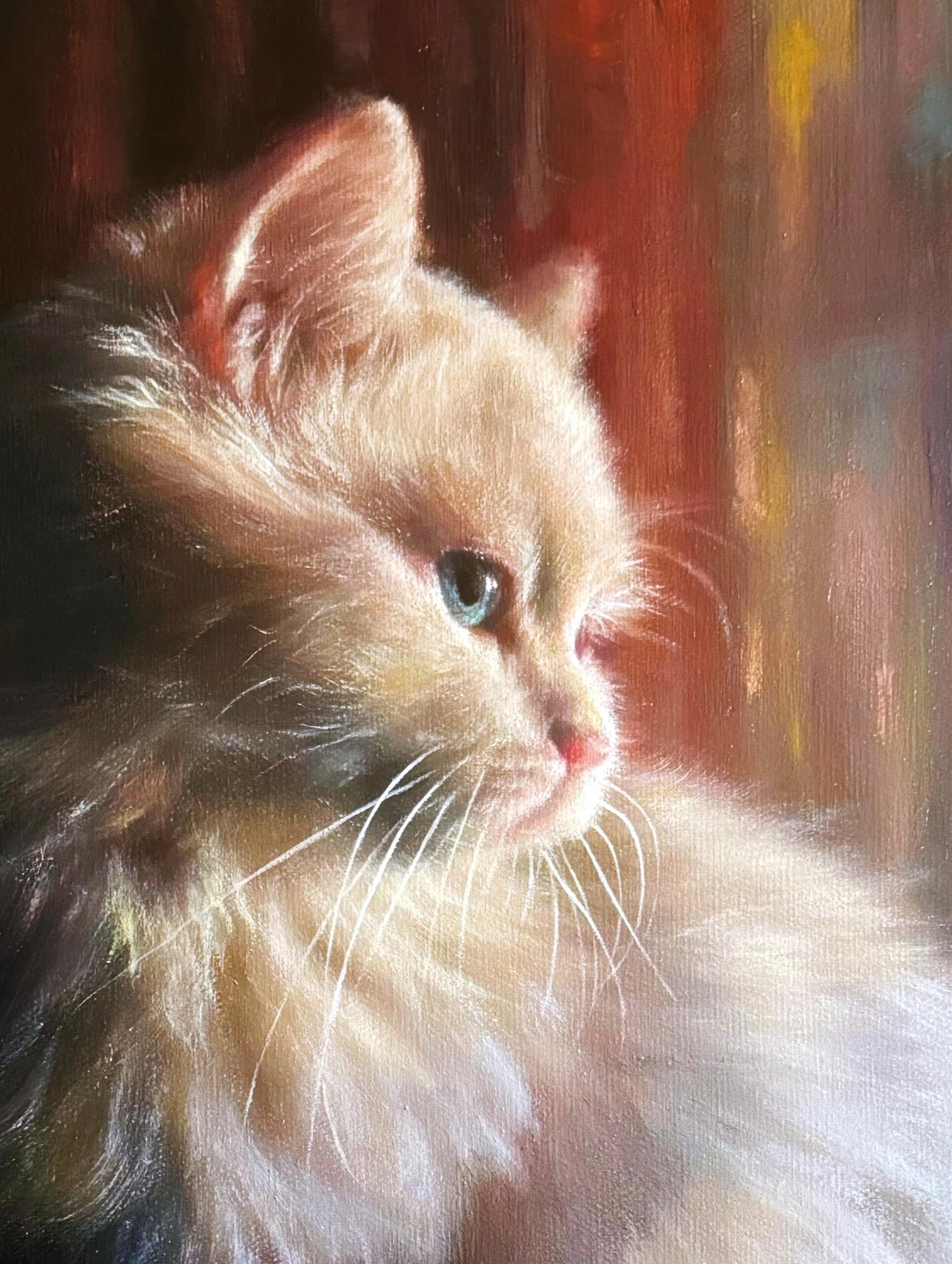 Close detail showing the brushwork in the kitten portrait
